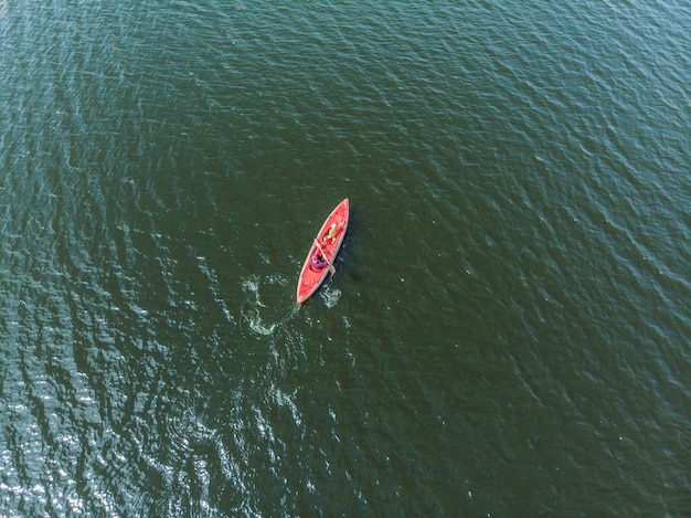 Aerial drone top view kayaking in the sea