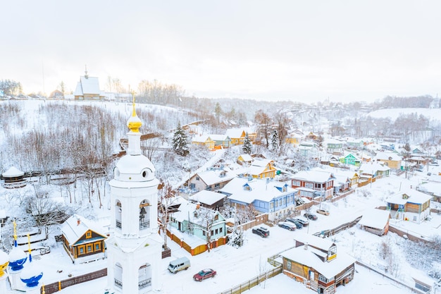 Aerial drone view of ancient russian town Ples on the Volga river in winter with snow Ivanovo region