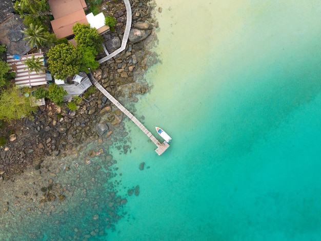 Aerial drone view of beautiful beach with turquoise sea water and palm trees of Gulf of Thailand Kood island Thailand