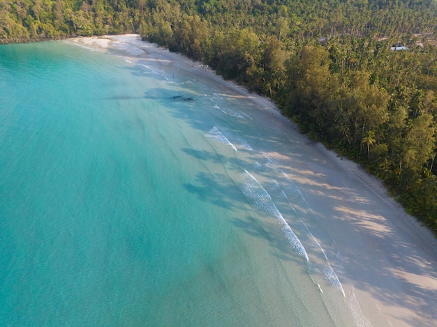 Aerial drone view of beautiful beach with turquoise sea water and palm trees of Gulf of Thailand Kood island Thailand