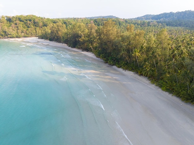 Aerial drone view of beautiful beach with turquoise sea water and palm trees of Gulf of Thailand Kood island Thailand