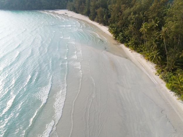 Aerial drone view of beautiful beach with turquoise sea water and palm trees of Gulf of Thailand Kood island Thailand