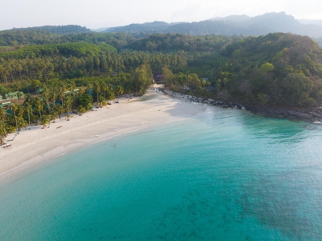 Aerial drone view of beautiful beach with turquoise sea water and palm trees of Gulf of Thailand Kood island Thailand