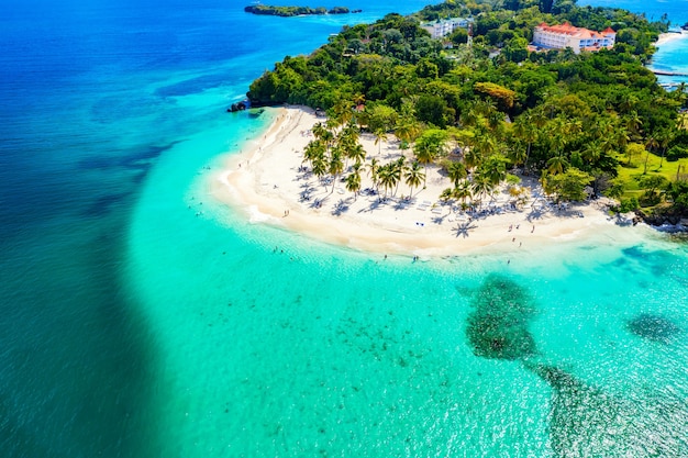 Aerial drone view of beautiful caribbean tropical island Cayo Levantado beach with palms. Bacardi Island, Dominican Republic. Vacation background.