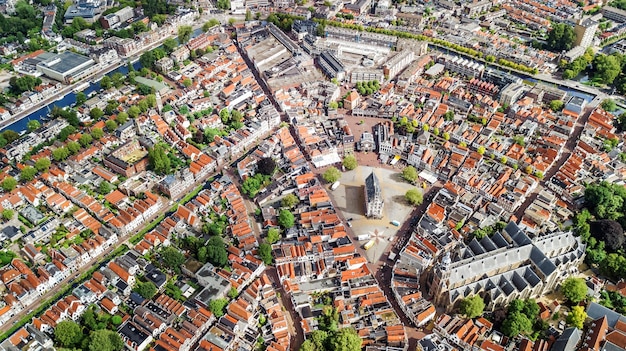 Aerial drone view of Gauda town cityscape from above typical Dutch city skyline with canals