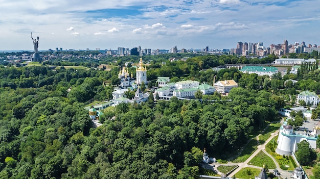 Aerial drone view of Kiev Pechersk Lavra churches on hills from above, cityscape of Kyiv city, Ukraine