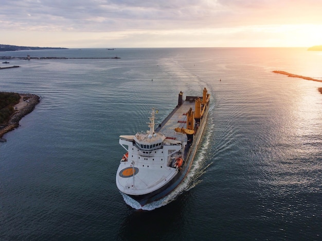 Aerial drone view of Large empty car cargo ship entering the port in Varna