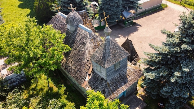 Aerial drone view of an old church with wooden roof in Moldova