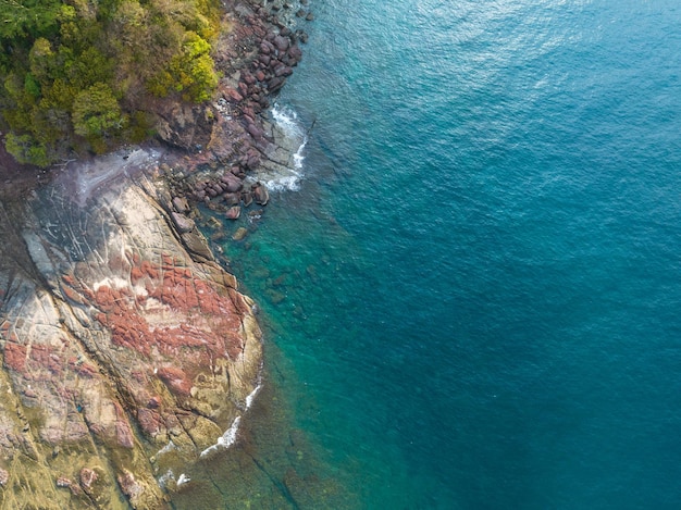 Aerial drone view of rocky coastline and beautiful turquoise sea water of Gulf of Thailand Kood island Thailand