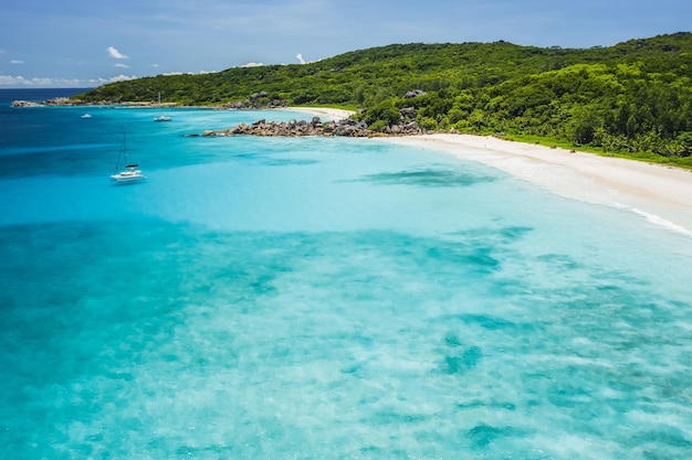 Aerial drone view of tropical paradise like beach with pure crystal clear turquoise water bizarre