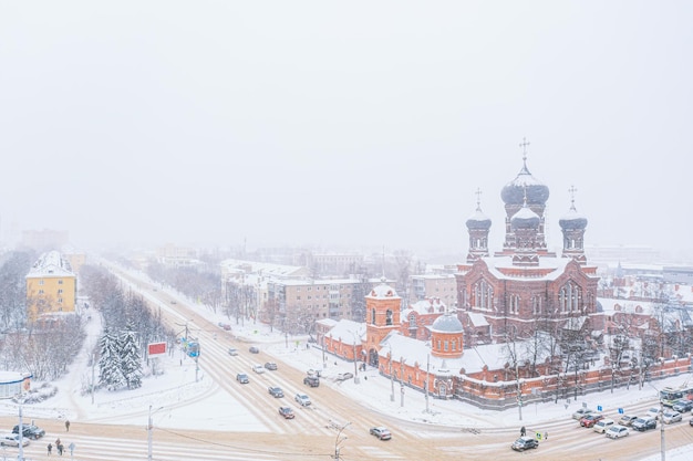 Aerial drone view of Vvedenskaya church in the city of Ivanovo Russia in winter with snow