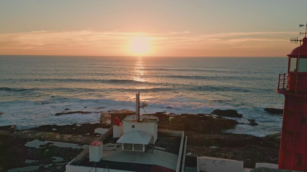 Aerial golden sundown horizon over beautiful endless ocean bright orange sunset