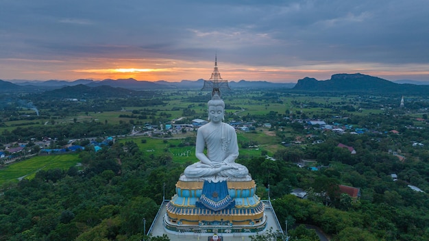 Aerial image of a large Buddha statue at Wat Nong Hoi Temple in Ratchaburi Thailand