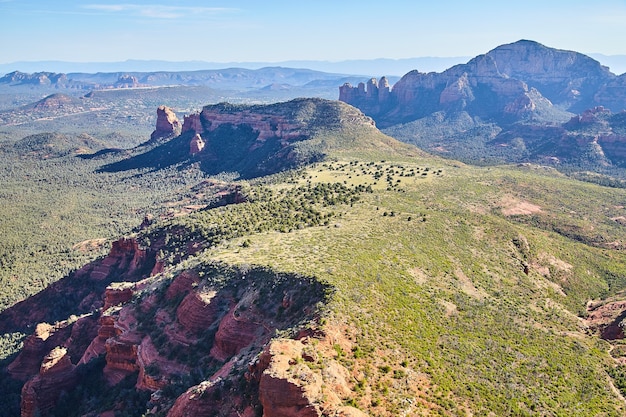 Aerial landscape of green field desert and mountains scattered