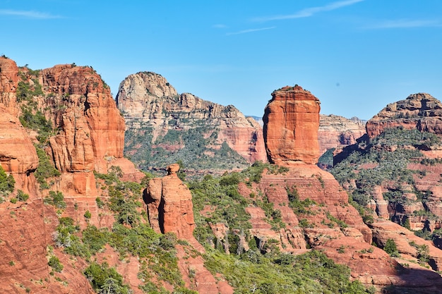 Aerial of large red rock in mountains