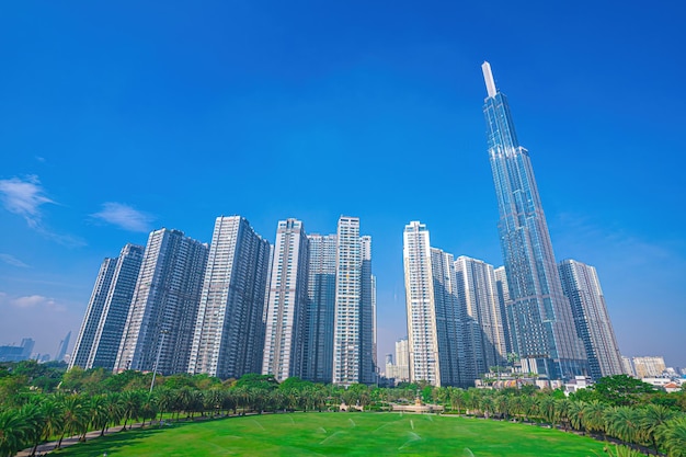 Aerial morning view with sunny and green trees at Landmark 81 it is a super tall skyscraper with development buildings along Saigon river in Ho Chi Minh city Vietnam Business travel concept