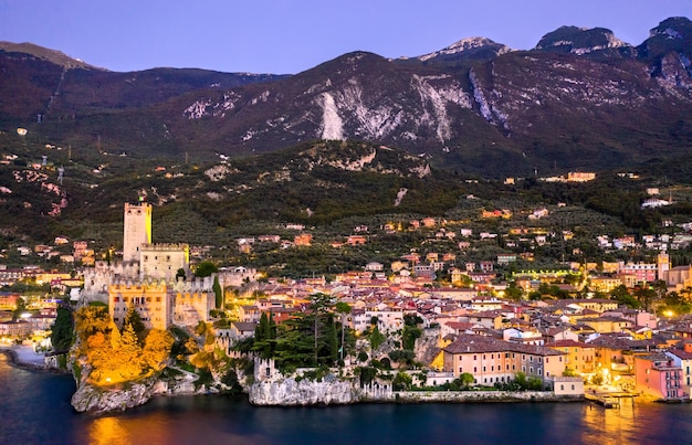 Aerial night view of scaliger castle in malcesine lake garda northern italy