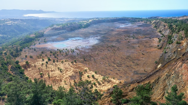 Aerial panorama of backfilled open pit Limni copper mine CyprusxA