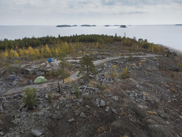 Aerial panorama of a campsite in a scenic Nordic location In the background you can see the archipelago of islands in the sea Theme of active rest