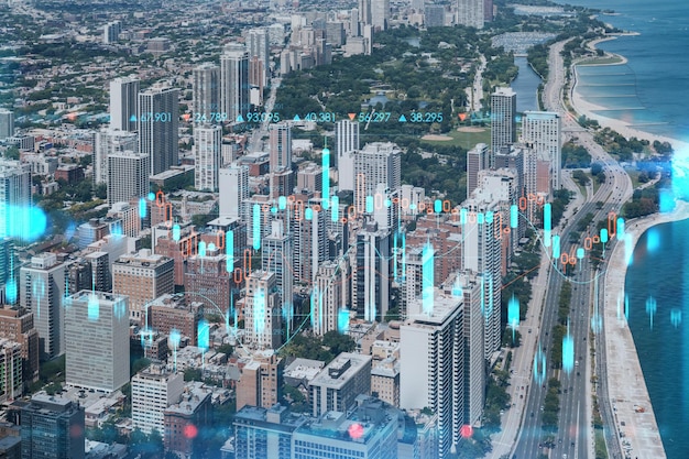 Aerial panorama city Chicago downtown area and Lake day time Illinois USA Birds eye view Forex graph hologram The concept of internet trading brokerage and fundamental analysis