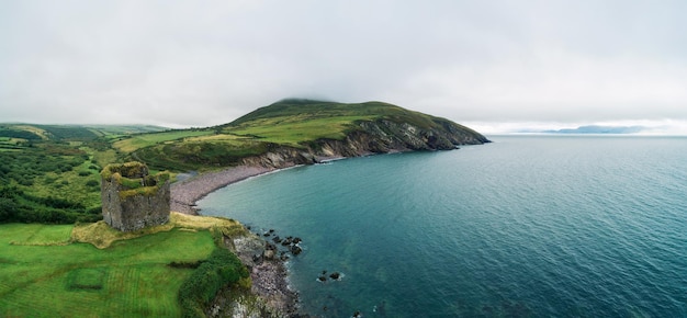 Aerial panorama of the Minard Castle situated on the Dingle Peninsula in Ireland