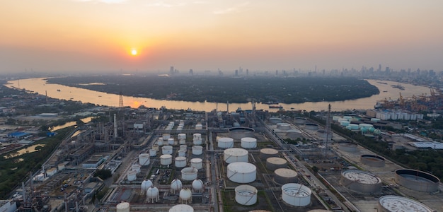 Aerial panorama view over oil refinery and river at twilight time.