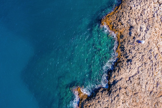 Aerial panoramic cityscape of Polignano a Mare town, Puglia region, Italy near Bari city, Europe. Superb scenic view of Adriatic sea. Traveling concept background.