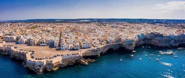 Aerial panoramic cityscape of Polignano a Mare town, Puglia region, Italy near Bari city, Europe. Superb scenic view of Adriatic sea. Traveling concept background.