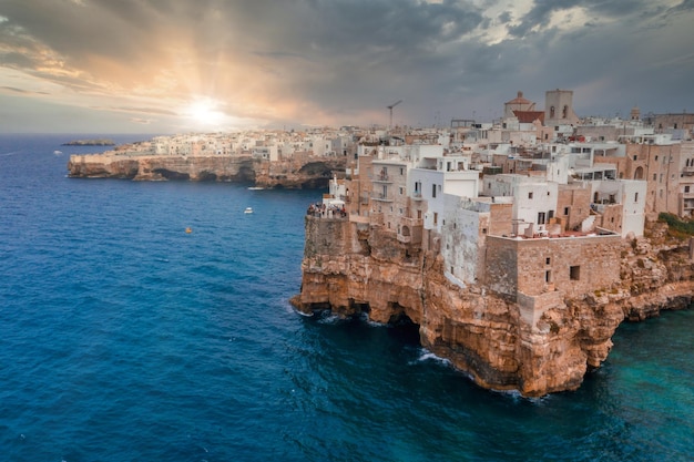 Aerial panoramic cityscape of Polignano a Mare town, Puglia region, Italy near Bari city, Europe. Superb scenic view of Adriatic sea. Traveling concept background.