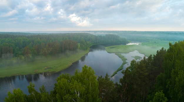 Aerial panoramic landscape with sunset over the river and beautiful clouds on the sky