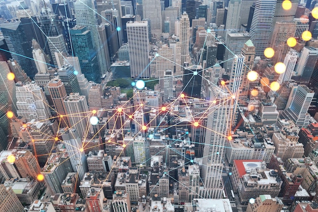 Aerial panoramic roof top city view of New York City Financial Downtown district at day time Manhattan NYC USA Social media hologram Concept of networking and establishing new people connections