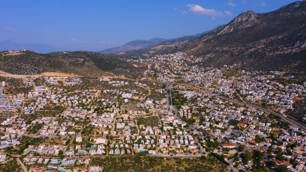 Aerial panoramic view of beautiful cityscape along mountains and sky touristic town in europe