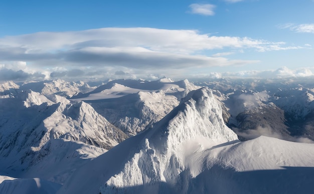 Aerial Panoramic View of Canadian Mountain covered in snow