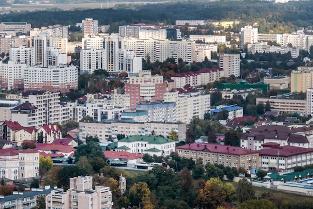 Aerial panoramic view from height of a multistorey residential complex and urban development in autumn day