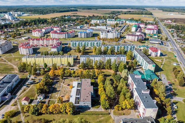 Aerial panoramic view from height of a multistorey residential complex and urban development in autumn day