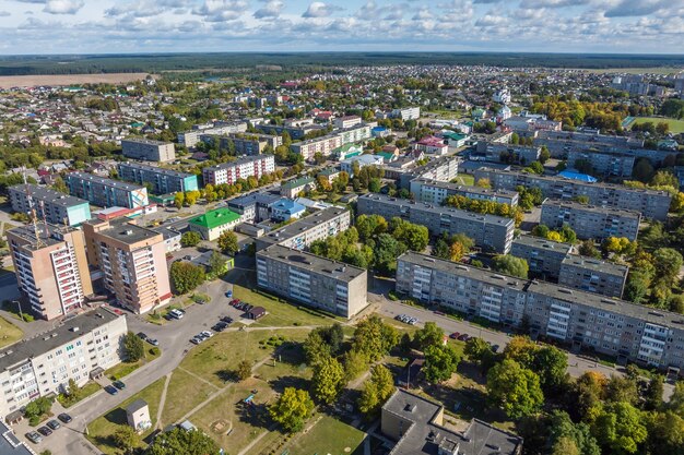 Aerial panoramic view from height of a multistorey residential complex and urban development in autumn day