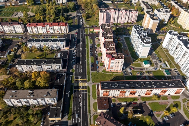 Aerial panoramic view from height of a multistorey residential complex and urban development in autumn day