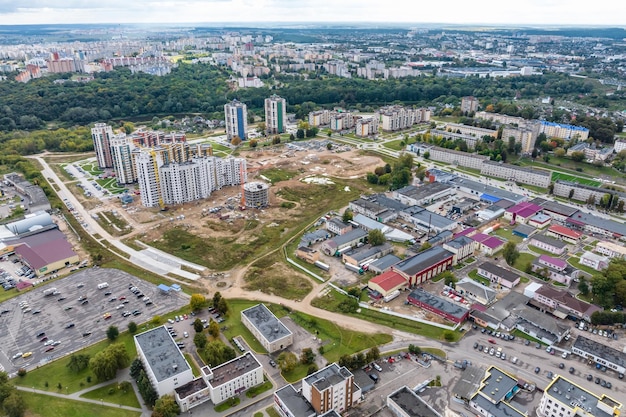 Aerial panoramic view from height of a multistorey residential complex and urban development in autumn day