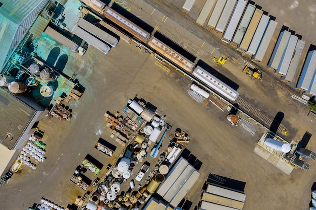 Aerial panoramic view metal scrap as waste collected in a part at junkyard scrap yard for recycling