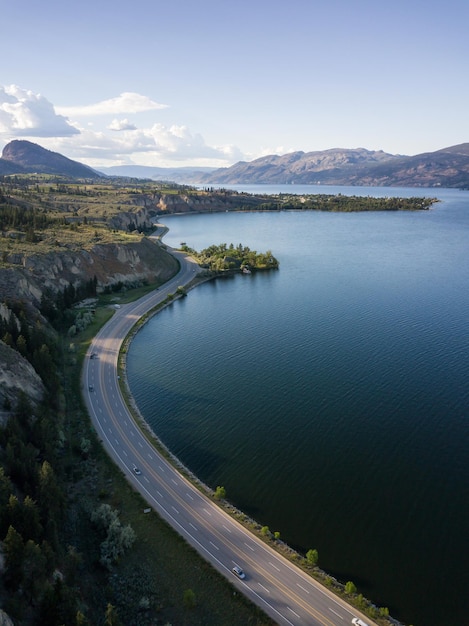 Aerial panoramic view of Okanagan Lake and Scenic Road