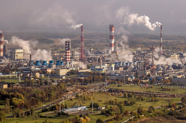 Aerial panoramic view on smoke of pipes of chemical enterprise plant Industrial landscape environmental pollution waste plant Air pollution concept