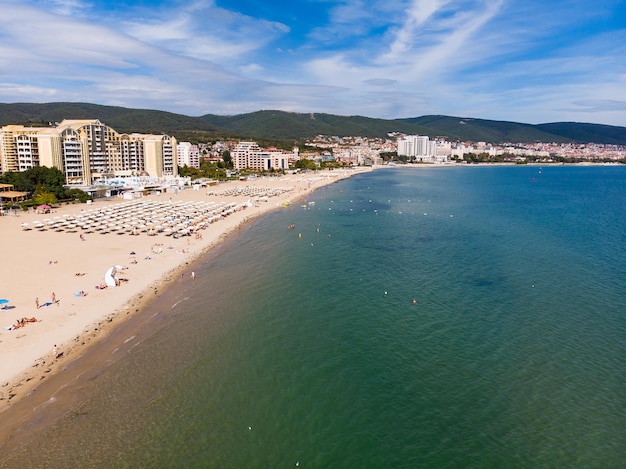 Aerial panoramic view of Sunny Beach area of Bulgaria sand beach sunbeds and sun umbrellas Drone view from above Summer holidays destination