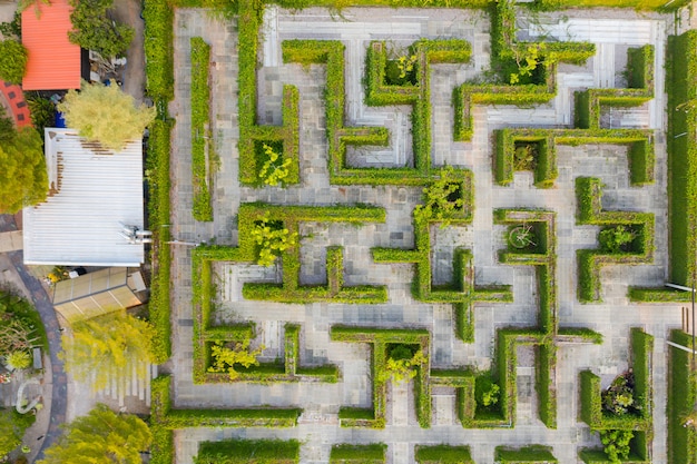 Aerial photo top view medium altitude above of maze green park garden