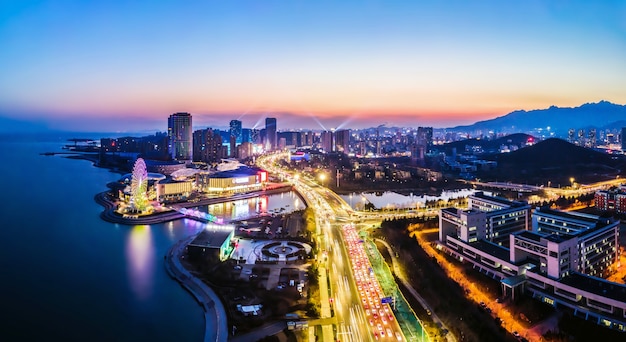 Aerial photography of the night view of the urban architectural landscape of Qingdao, China