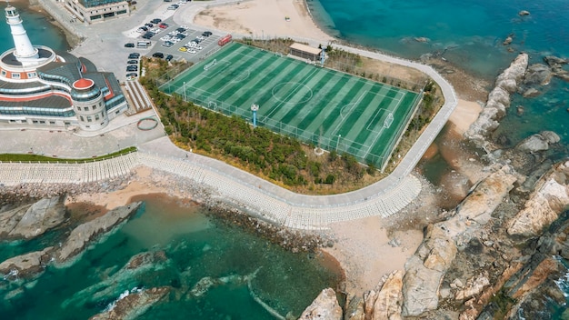 Aerial photography of reef football field along the coast of Qingdao