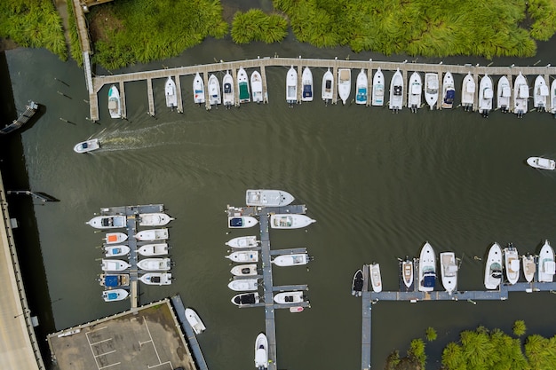 Aerial pier little wood platform for boat in the ocean marina