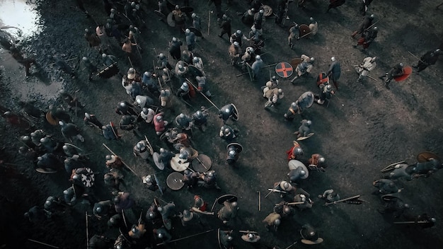 Aerial shot of the Battlefield where Armies of Medieval Warriors Fighting Medieval Reenactment