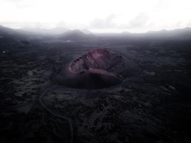 Aerial shot of Mauna Loa volcano in Hawaii with ashes in the surroundings