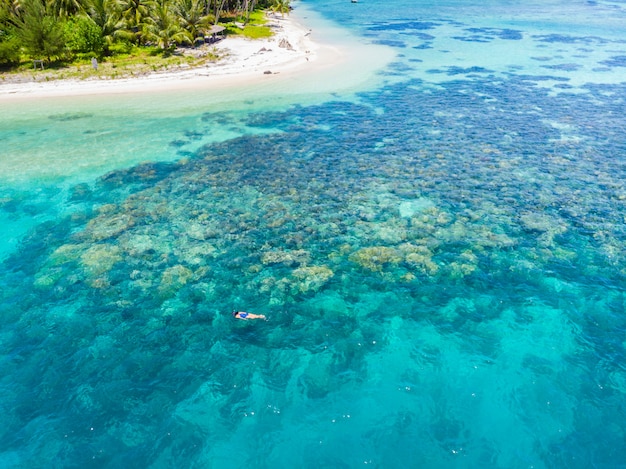 Aerial snorkeling on coral reef tropical island caribbean sea turquoise water