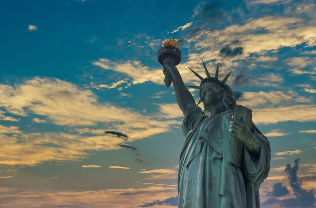 Aerial sunset with Statue of Liberty in Manhattan New York City USA